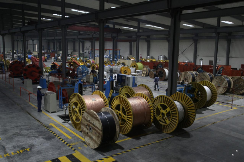 A worker monitors automatic copper wire unit at the Fast Cables plant in Lahore, Pakistan, March 24, 2017. Picture taken March 24, 2017. (Reuters)