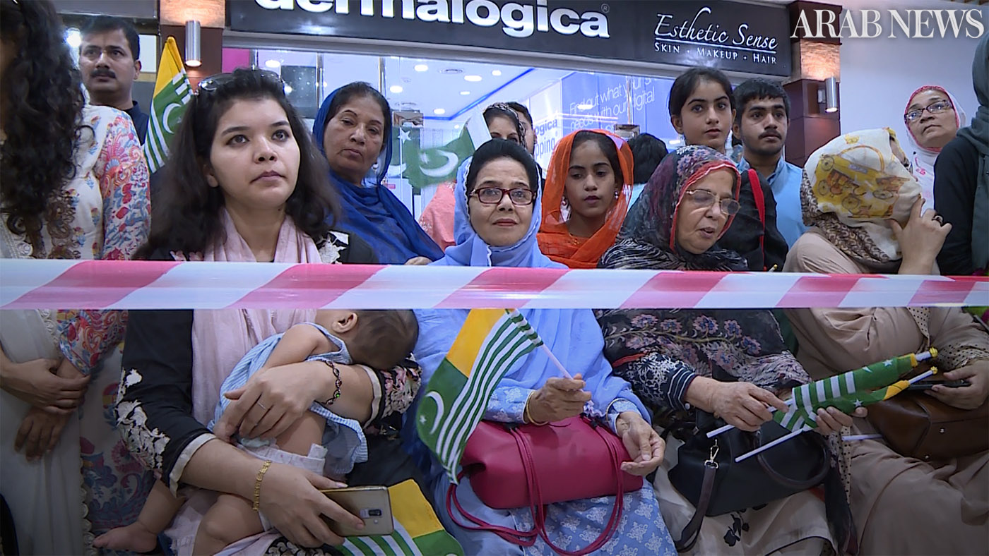 Shoppers watch and film from the multistory mega mall as university students perform a skit on Kashmir to raise awareness on the plight of Kashmiris in Indian administered Kashmir. (AN photo by Sib Kaifee)