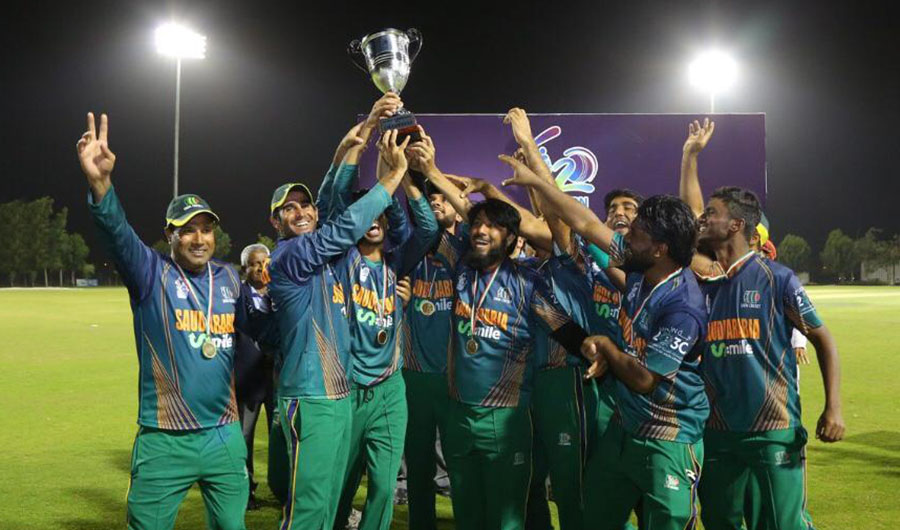 This undated file photo shows Saudi Arabian cricketers lifting the ACC T20 Western Region Championship trophy.