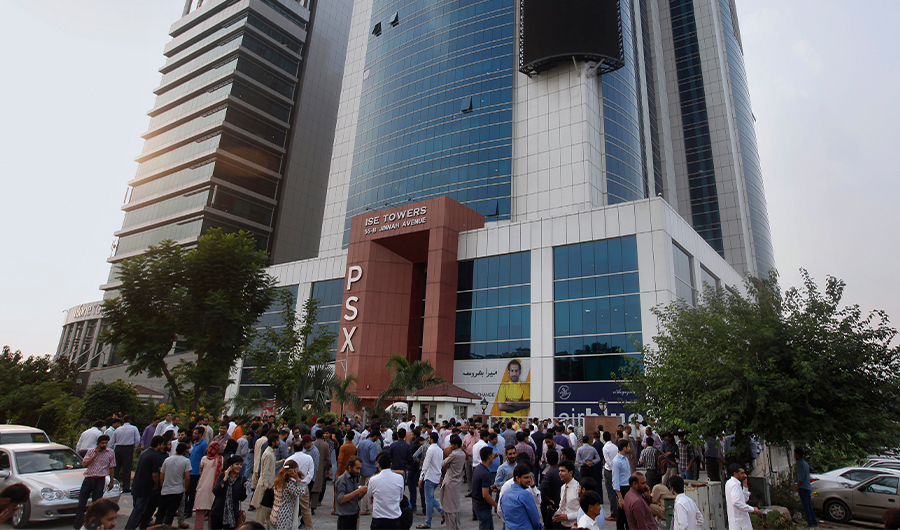 People gather outside their office building after an earthquake is felt in Islamabad, Pakistan, Tuesday, Sept. 24, 2019. A powerful 5.8-magnitude earthquake has struck Pakistan's capital Islamabad and other cities in the eastern Punjab province, scaring many people who rushed out of multistory buildings and homes. (AP)