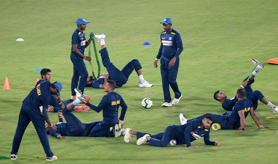 Sri Lanka's team warm up before the team cricket practice session at the National Stadium in Karachi on September 26, 2019. Karachi hosts a one-day international for the first time in 10 years when Pakistan take on a depleted Sri Lanka on September 27, furthering the country's revival in international cricket. (AFP)