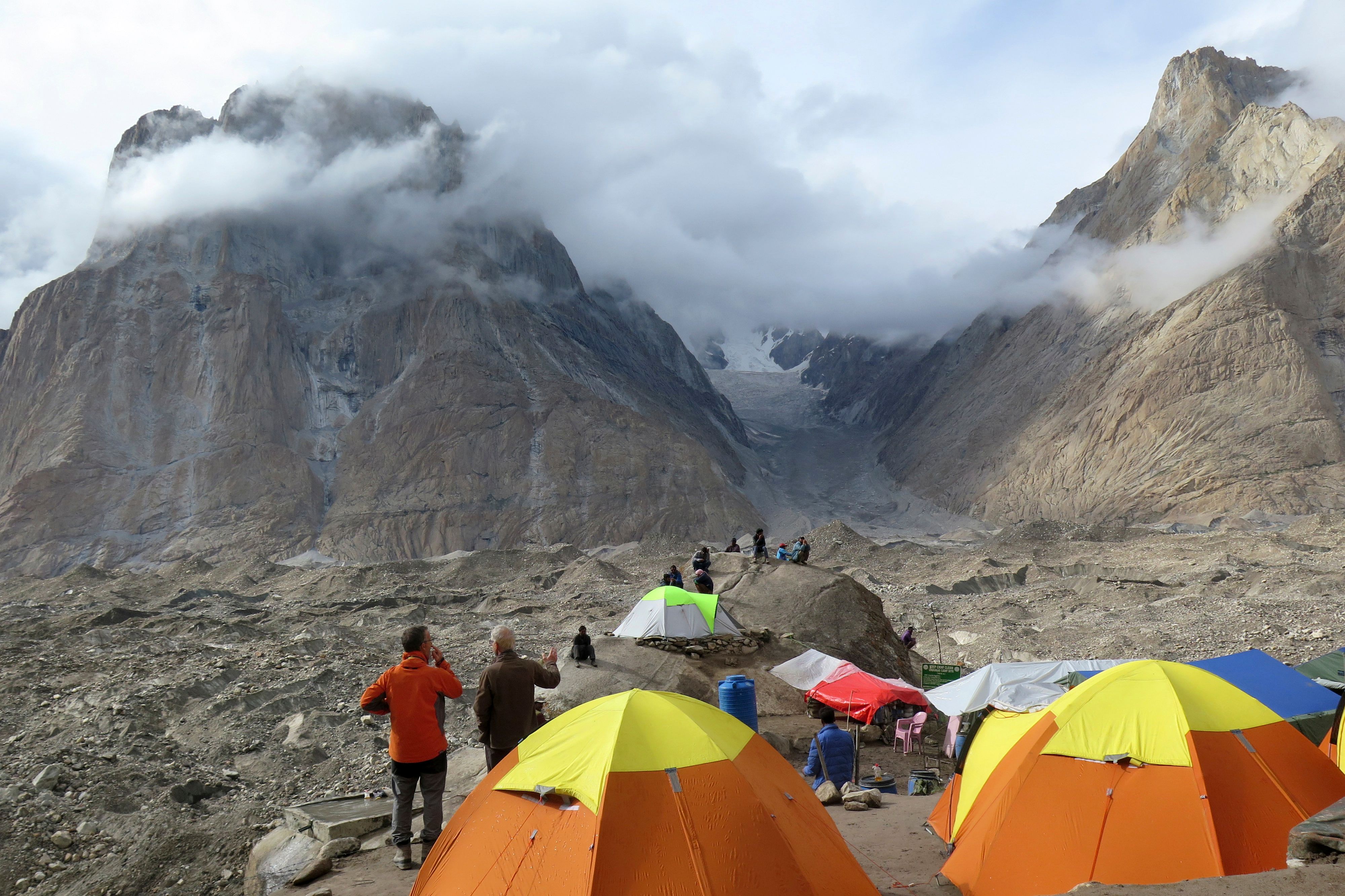 In this picture taken on August 12, 2019 foreign tourists and porters rest at a camping site above Baltoro glacier in the Karakoram range of Pakistan's mountain northern Gilgit region. (AFP/File)