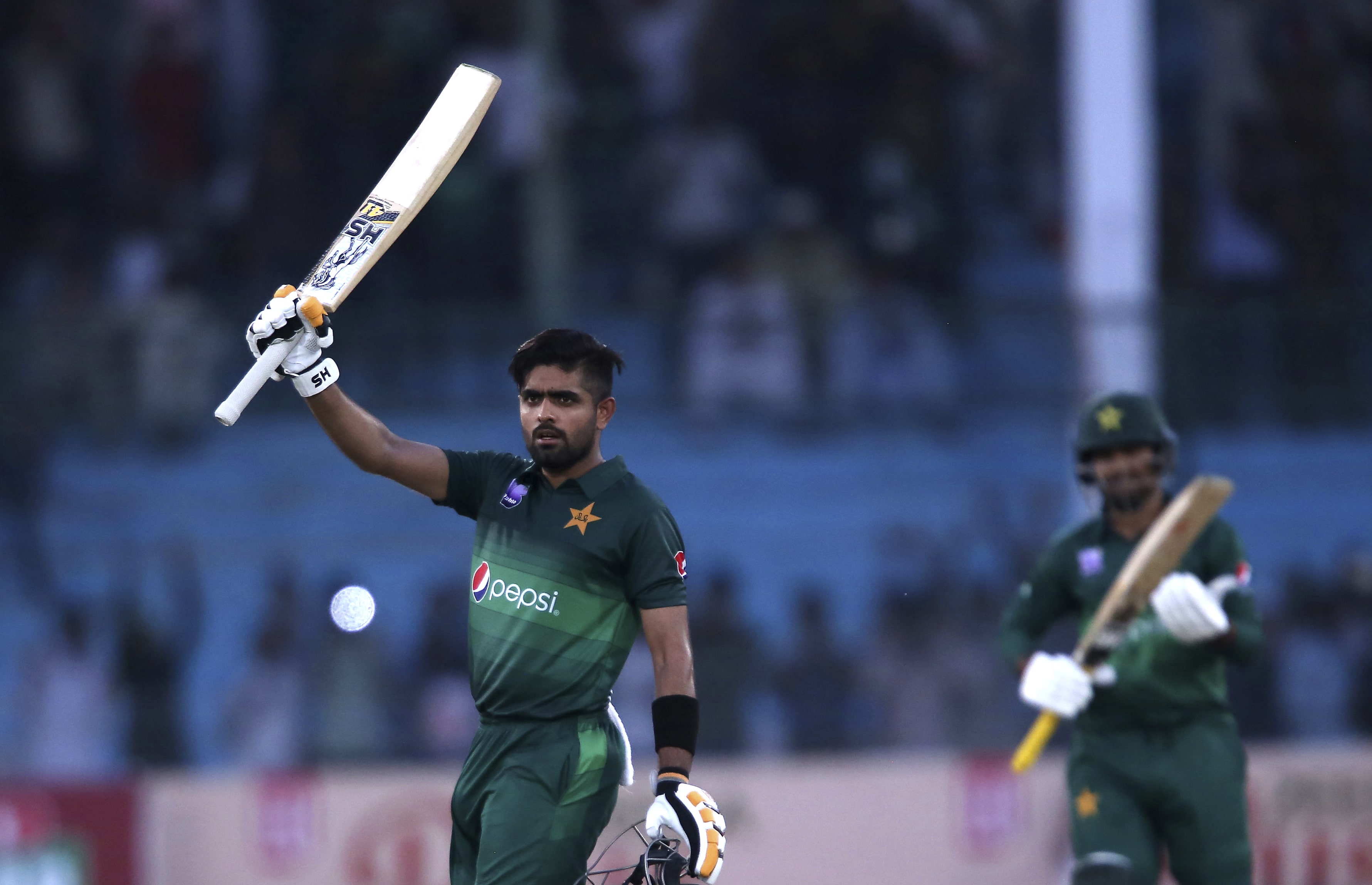 Pakistan’s batman Babar Azam celebrates his century against Sri Lanka in Karachi, Pakistan, Monday, Sept. 30, 2019. Pakistan and Sri Lanka are playing the second one-day international. Pakistani captain Sarfaraz Ahmed seen at right. (AP)