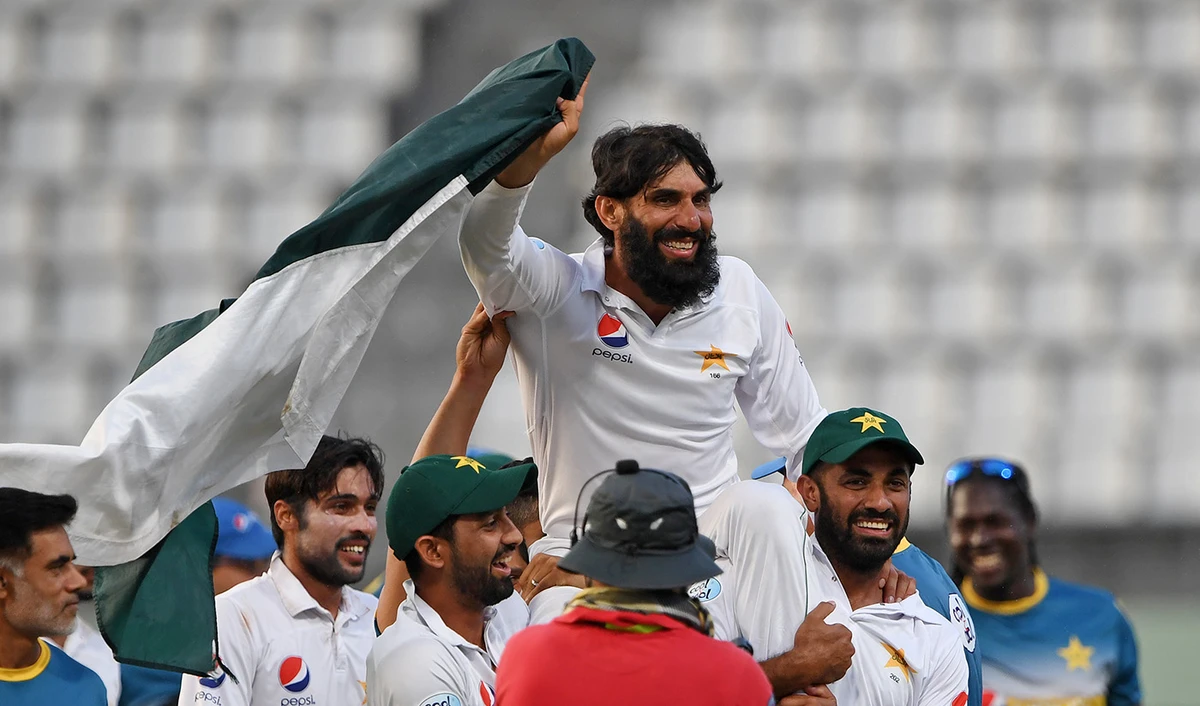 In this file photo, Misbah-ul-Haq is carried by teammates as they celebrate winning the final test match and the series 2-1 against West Indies at the Windsor Park Stadium in Roseau, Dominica on May 14, 2017. (AFP)
