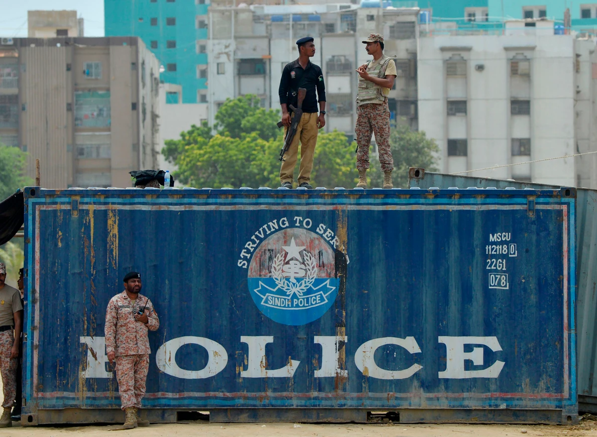 Pakistani security personnel cordon the area during the Shiite Muslim religious procession on the first Muslim month of Muharram in Karachi on September 8, 2019. Ashura is one of the most important festivals for Shiite Muslims, and falls on the 10th day of Muharram, which is the mourning period for the seventh-century killing of Imam Hussein, the grandson of the Prophet Muhammad. (AFP)