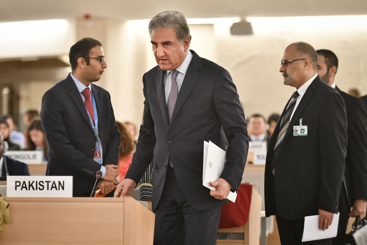 Pakistani Foreign Minister Shah Mehmood Qureshi (C) arrives to address the United Nations Human Rights Council on September 10, 2019 in Geneva. (AFP)