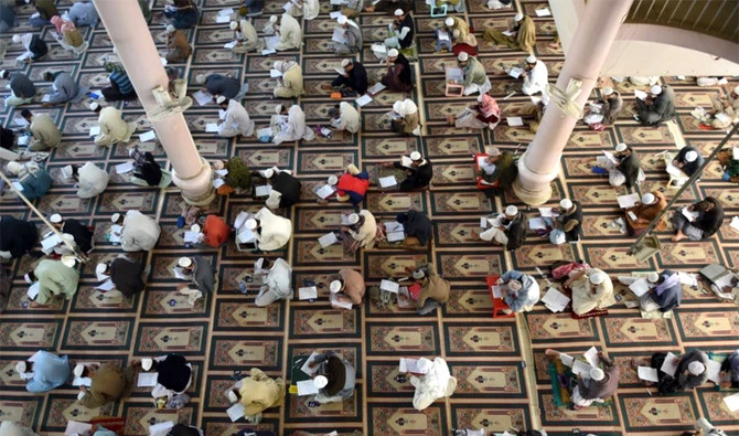 In this file photo, Islamic religious students take mid-term exams at Jamia Binoria, a seminary in Karachi, on Jan. 26, 2017. (AFP)
