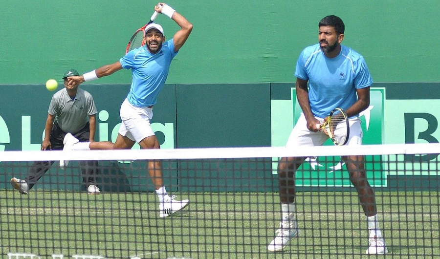 Indian doubles pair of Rohan Bopanna and Divij Sharan in action against Italy's Matteo Berrettini and Simone Bolelli at the Davis Cup World Group doubles rubber in Kolkata on Feb. 2, 2019. (Photo courtesy : Kuntal Chakrabarty/IANS)
