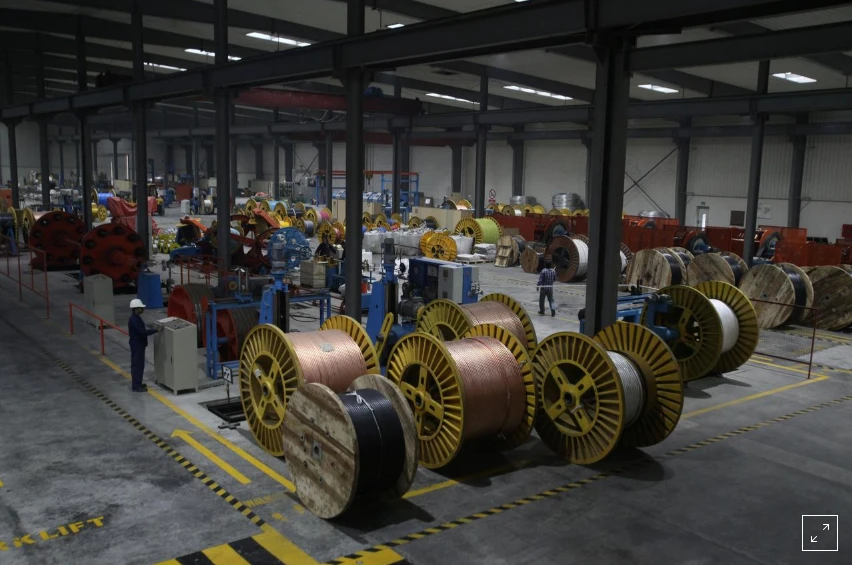 A worker monitors automatic copper wire unit at the Fast Cables plant in Lahore, Pakistan, March 24, 2017. Picture taken March 24, 2017. (Reuters)