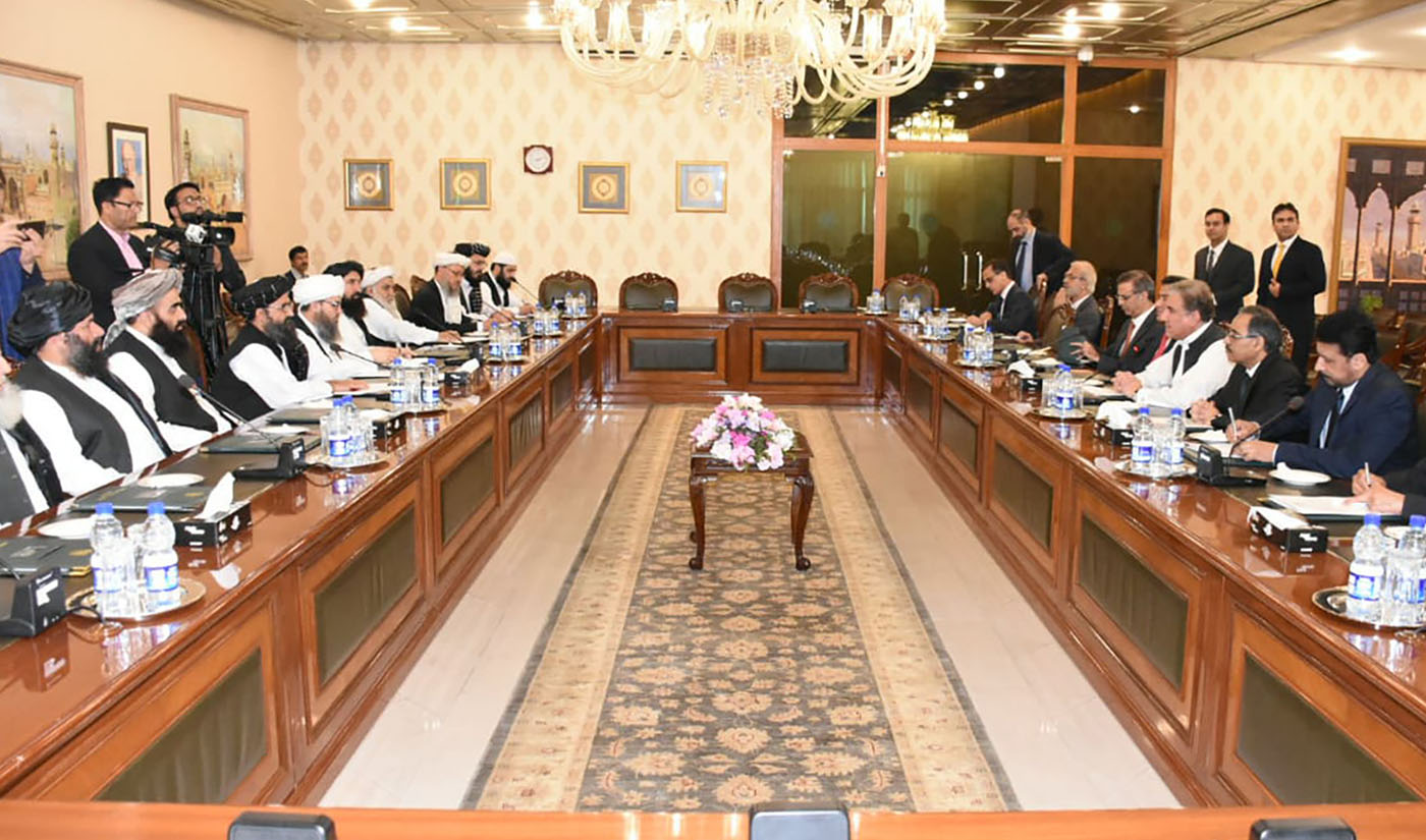 In this photo released by the Foreign Office, Pakistan's Foreign Minister Shah Mehmood Qureshi, fourth from right, heads talks with Taliban delegation at the Foreign Office in Islamabad, Pakistan on Oct. 3, 2019. (Pakistan Foreign Office via AP)