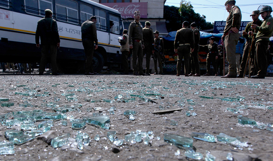 In this file photo, Police inspect the site of a grenade blast at a bus station in Jammu on March 7, 2019. (AFP)