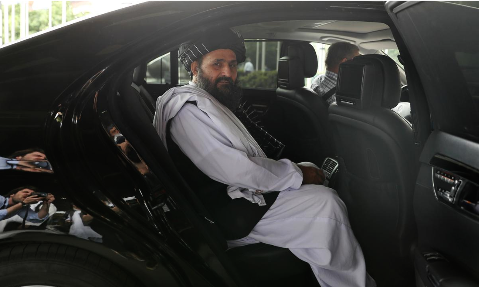 Taliban chief negotiator Mullah Abdul Ghani Baradar sits in a car after the end of peace talks with Afghan senior politicians in Moscow, Russia May 30, 2019. (REUTERS/FILE PHOTO)