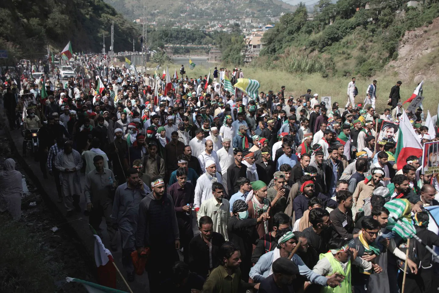 Supporters of Jammu Kashmir Liberation Front march toward the Line of Control, outskirts of Muzaffarabad, the capital of Pakistani Kashmir, Saturday, Oct. 5, 2019. (M.D. Mughal/AP)
