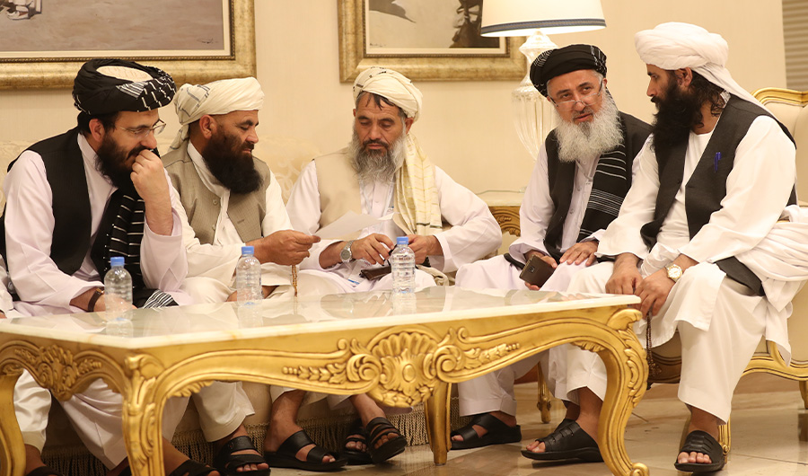 In this file photo, Mohammad Nabi Omari (L), a Taliban member formerly held by the US at Guantanamo Bay and reportedly released in 2014 in a prisoner exchange, sits with other members during the second day of the Intra Afghan Dialogue talks in the Qatari capital Doha on July 8, 2019. (File/ AFP)