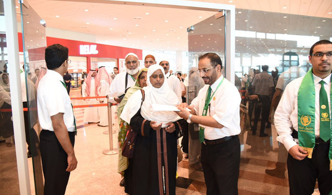 A team of Saudi officials check travel documents for Hajj pilgrims at Islamabad International Airport. The Saudi team installed a pre-immigration system at the airport to facilitate Pakistani travellers flying to Makkah and Madinah this year, under the Road to Makkah Project. July 4, 2019. (Photo Courtesy – Saudi Embassy)