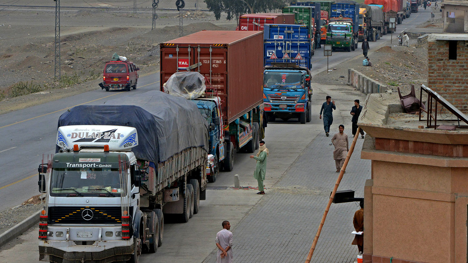 Trucks and other vehicles travel in the mountainous area near Torkham, close to the Pakistan-Afghanistan border, on March 21, 2017. (AFP/File)