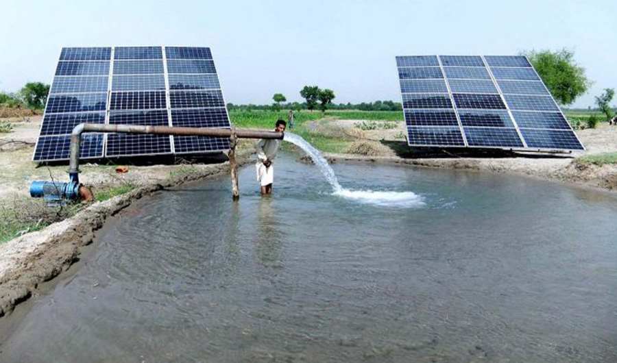 In this file photo, a farmer drinking water from tube well running through solar panel on June 30, 2019 in Chiniot Pakistan. (File/ APP)