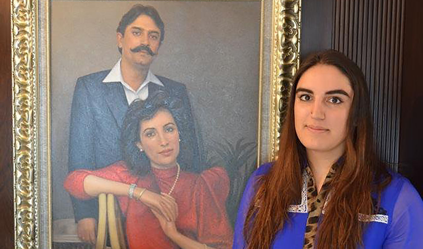 Daughter of former President Asif Ali Zardari and former Prime Minister Benazir Bhutto (late), Bakhtawar Bhutto Zardari standing in front of a portrait of her parents. (Photo Courtesy: Bakhtawar's Twitter Account)