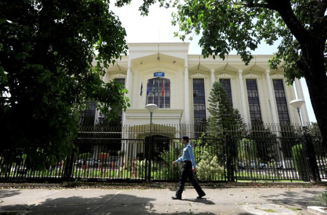 A policeman walks past the Federal Board of Revenue (FBR) office building in Islamabad, August 29, 2018. (REUTERS/File)