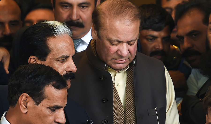 In this file photo, Deposed Former Pakistani prime minister Nawaz Sharif (C) leaves the Supreme Court building after the shrine land case hearing in Islamabad on December 4, 2018. (File/ AFP)