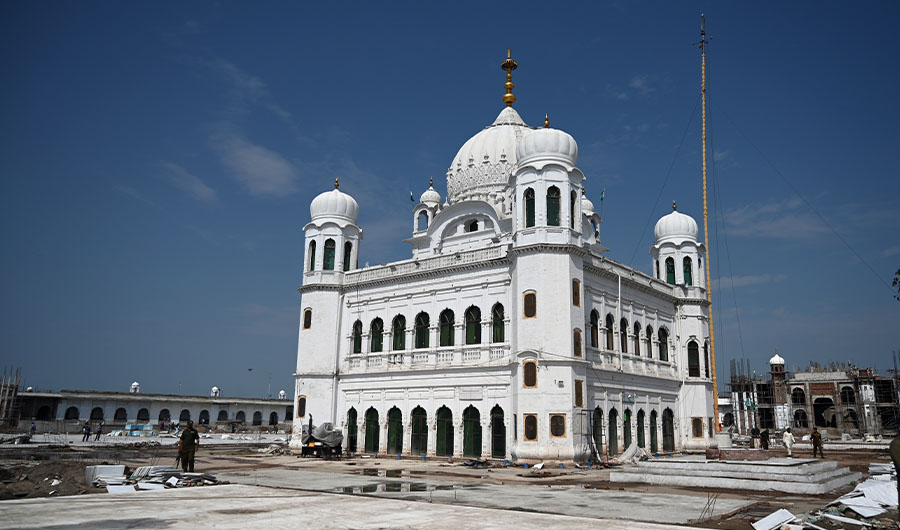 In this picture taken on September 16, 2019 a Pakistani policeman stands guard on the construction site at the Sikh religious site Gurdwara Darbar Sahib, in the Pakistani town of Kartarpur near the Indian border. Pakistan on September 16 announced that the Kartarpur corridor will be opened for Indian Sikh pilgrims early this November. (AFP)