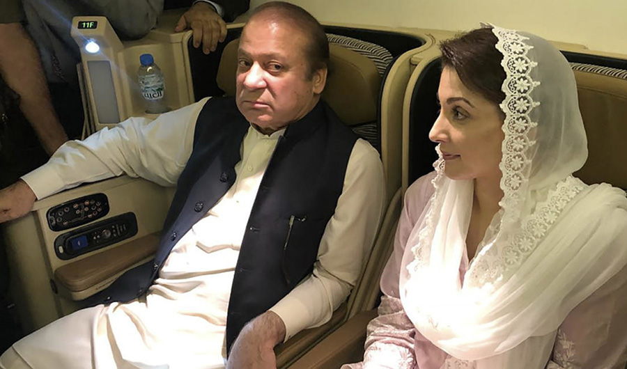 Pakistan’s former prime minister Nawaz Sharif (left) and his daughter Maryam Nawaz wait in the plane following their arrival in Lahore, on July 14, 2018. ( AFP/File)