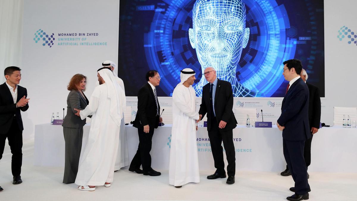 Dignitaries gather below a screen at the launch of Mohamed bin Zayed University of Artificial intelligence in Abu Dhabi on October 16. (Courtesy :The National / Chris Whiteoak)