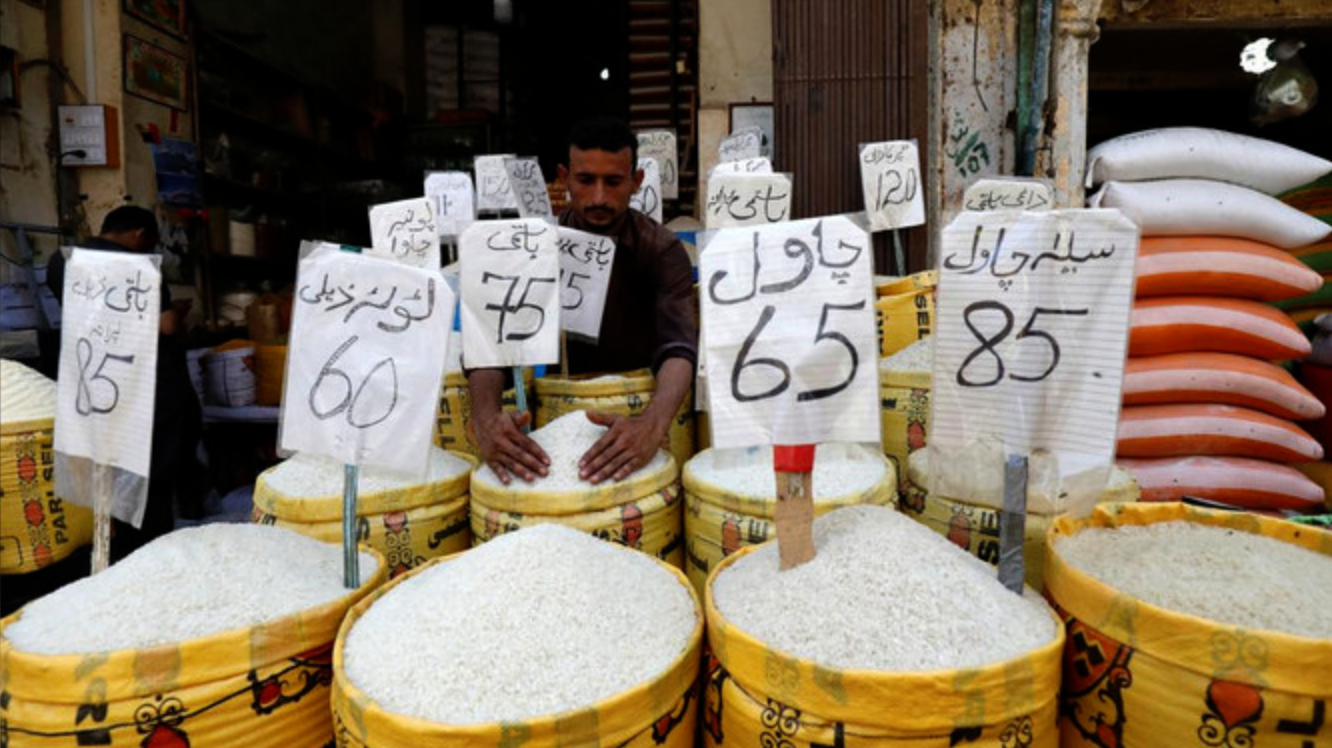 In this file photo, a vendor arranges different types of rice, with their prices displayed, at his shop in a wholesale market in Karachi, Pakistan April 2, 2019. (REUTERS)