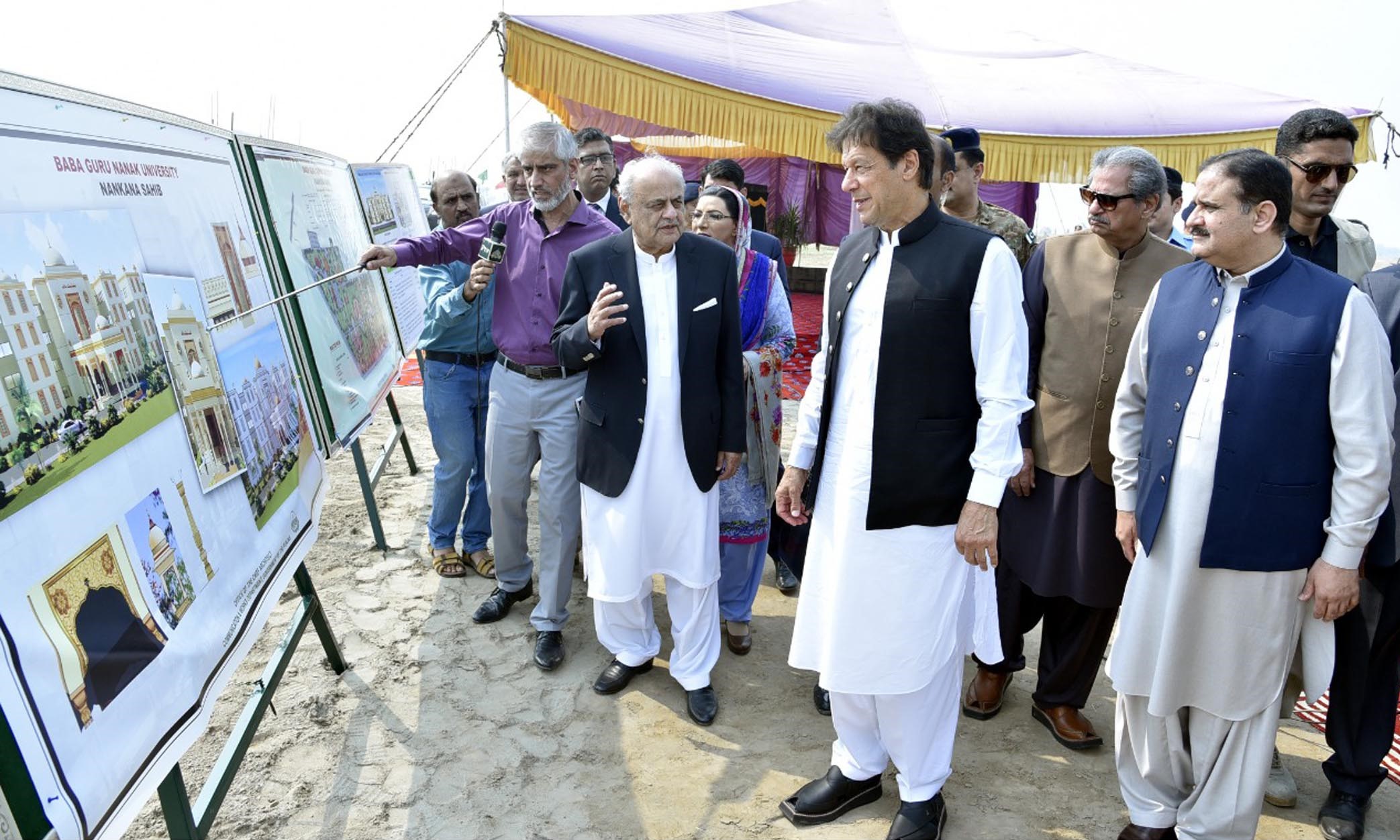 Prime Minister Imran Khan being briefed about Baba Guru Nanak University project in Nankana Sahib on October 28, 2019. (PID)