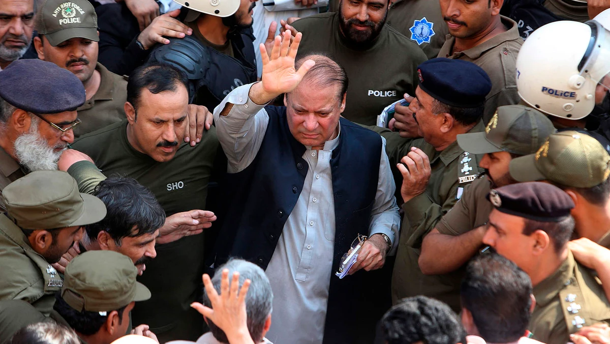 Police escort jailed former Pakistani prime minister Nawaz Sharif, center, as he leaves the accountability court in Lahore on Oct. 11, 2019. (AFP)