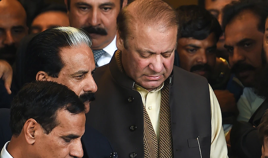 In this file photo, Deposed Former Pakistani prime minister Nawaz Sharif (C) leaves the Supreme Court building after the shrine land case hearing in Islamabad on December 4, 2018. (File/ AFP)