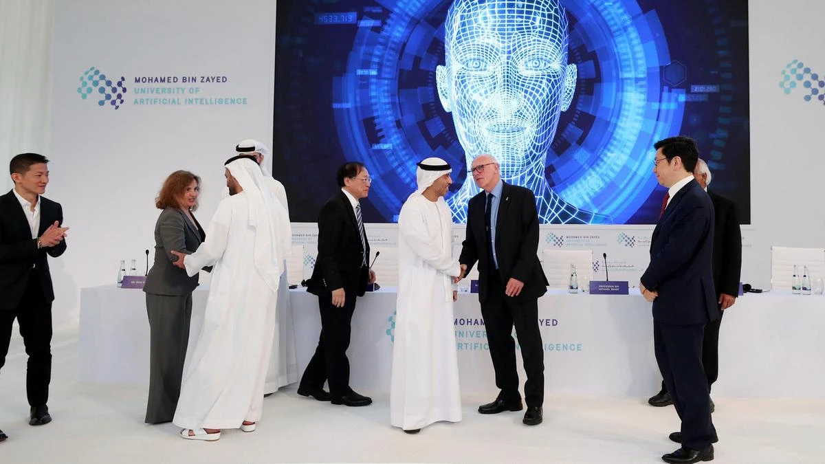 Dignitaries gather below a screen at the launch of Mohamed bin Zayed University of Artificial intelligence in Abu Dhabi on October 16. (Courtesy :The National / Chris Whiteoak)