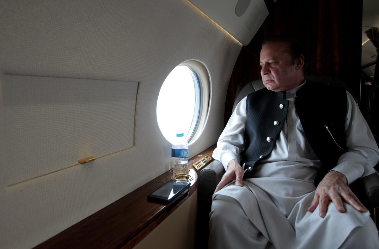 In this file photo, Pakistan's former Prime Minister Nawaz Sharif looks out the window of his plane after attending a ceremony to inaugurate the M9 motorway between Karachi and Hyderabad, Pakistan on Feb. 3, 2017. (REUTERS)