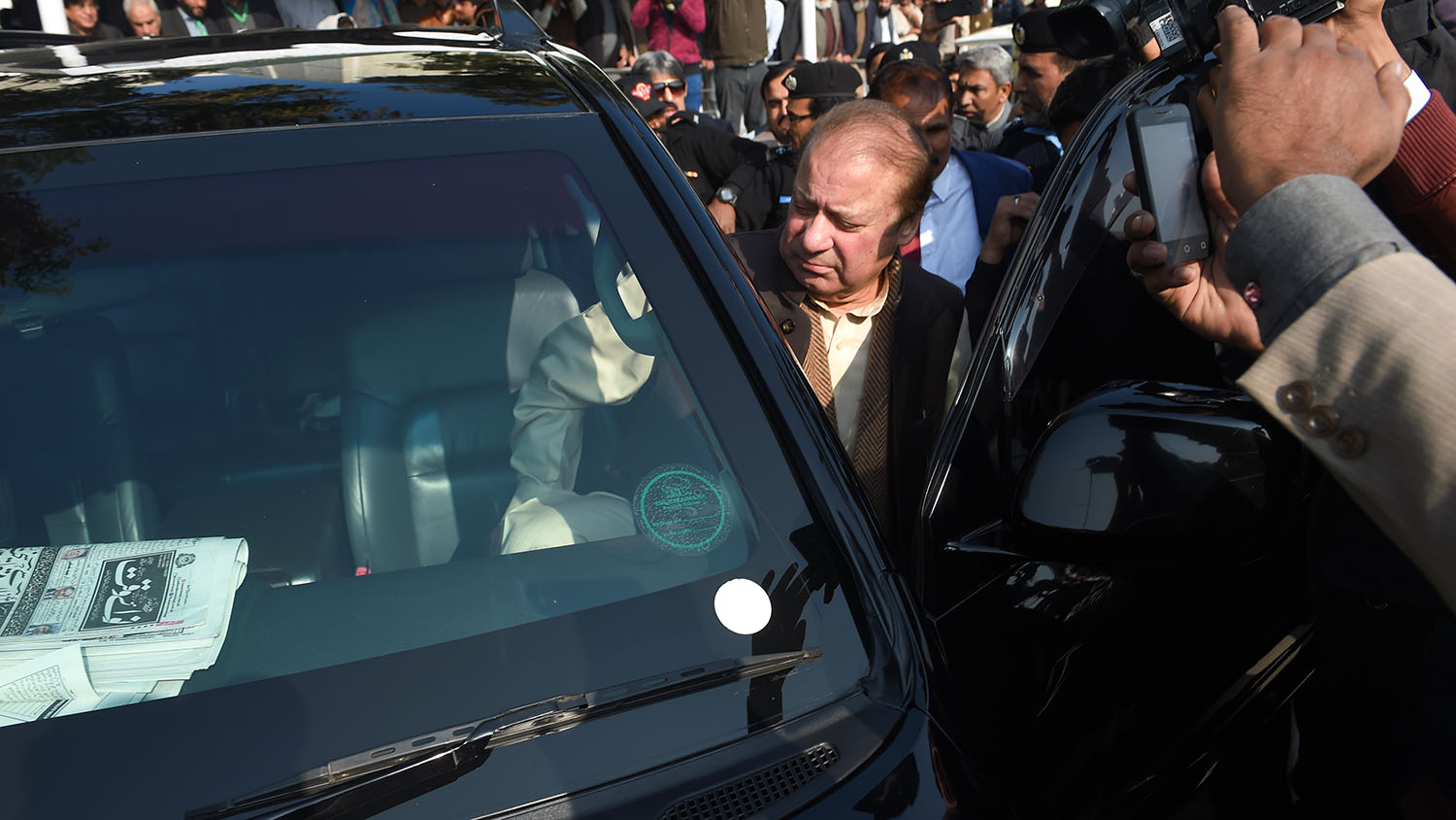 In this file photo, Pakistan's ailing former prime minister Nawaz Sharif, center, enters a car as he leaves the Supreme Court following the shrine land case hearing in Islamabad on Dec. 4, 2018. (AFP)
