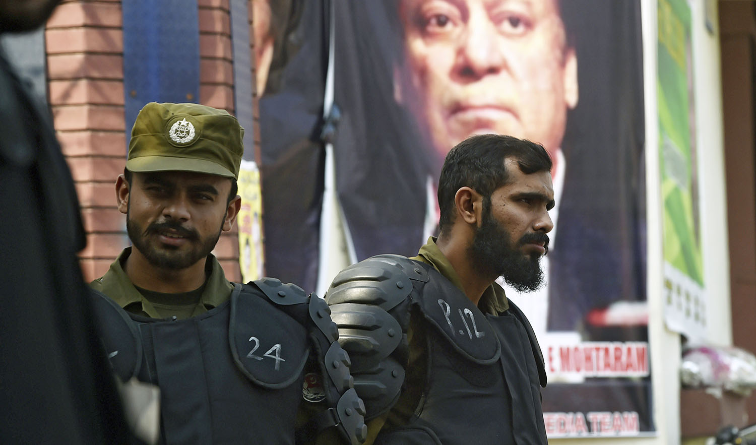 In this file photo, Policemen stand guard outside a hospital where former Prime Minister Nawaz Sharif is admitted after his condition deteriorated, in Lahore on Oct. 24, 2019. (AFP)