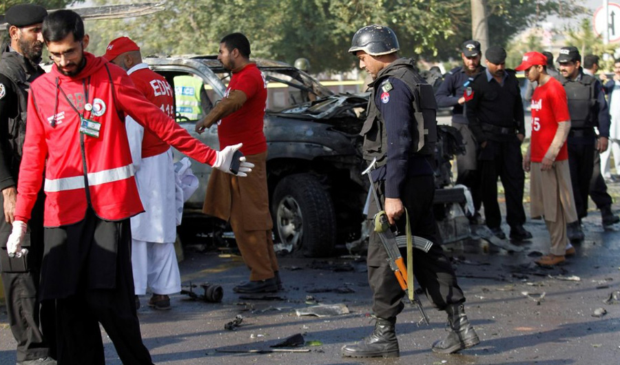In this file photo, police and rescue personnel inspect a vehicle damaged by a suicide bomber which killed a senior Pakistani police official on his way to work in Peshawar, Pakistan November 24, 2017. (File/ REUTERS)
