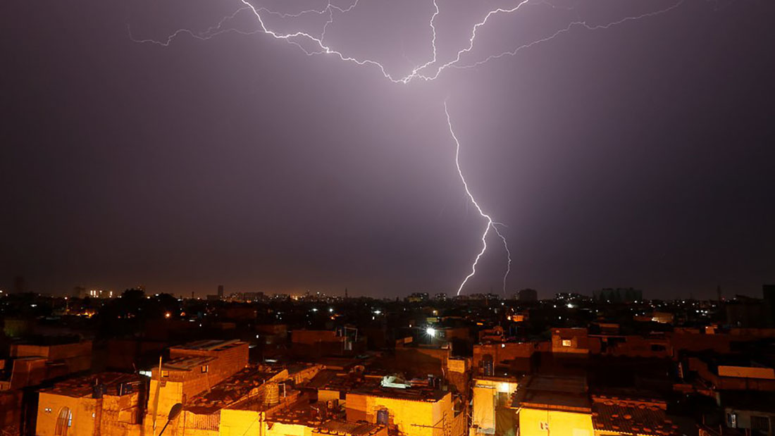 In this file photo, lightning bolt is seen above a residential neighborhood during rain in Karachi on Aug. 21, 2017. (REUTERS)