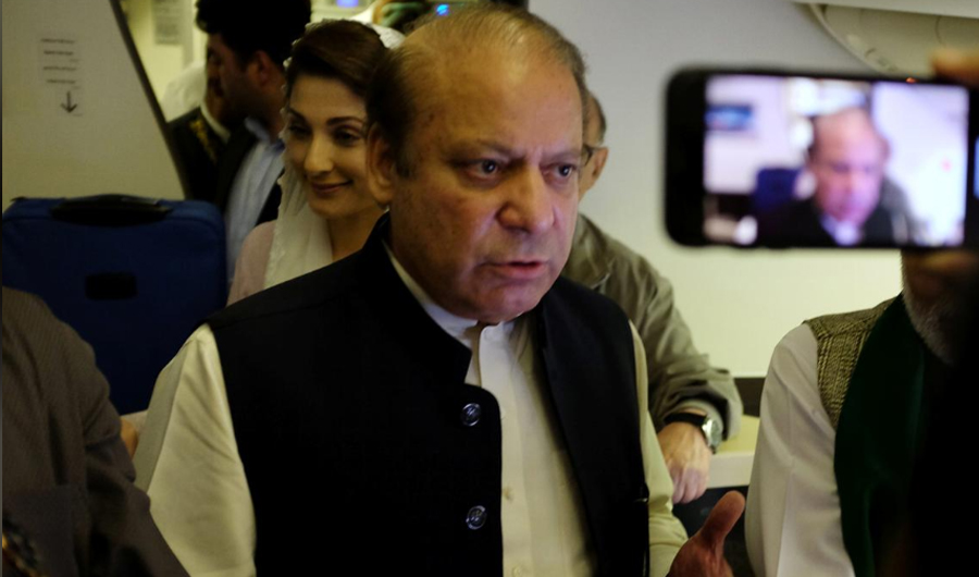 FILE PHOTO: Ousted Pakistani Prime Minister Nawaz Sharif gestures as he boards a Lahore-bound flight due for departure, at Abu Dhabi International Airport, UAE July 13, 2018. (Reuters)