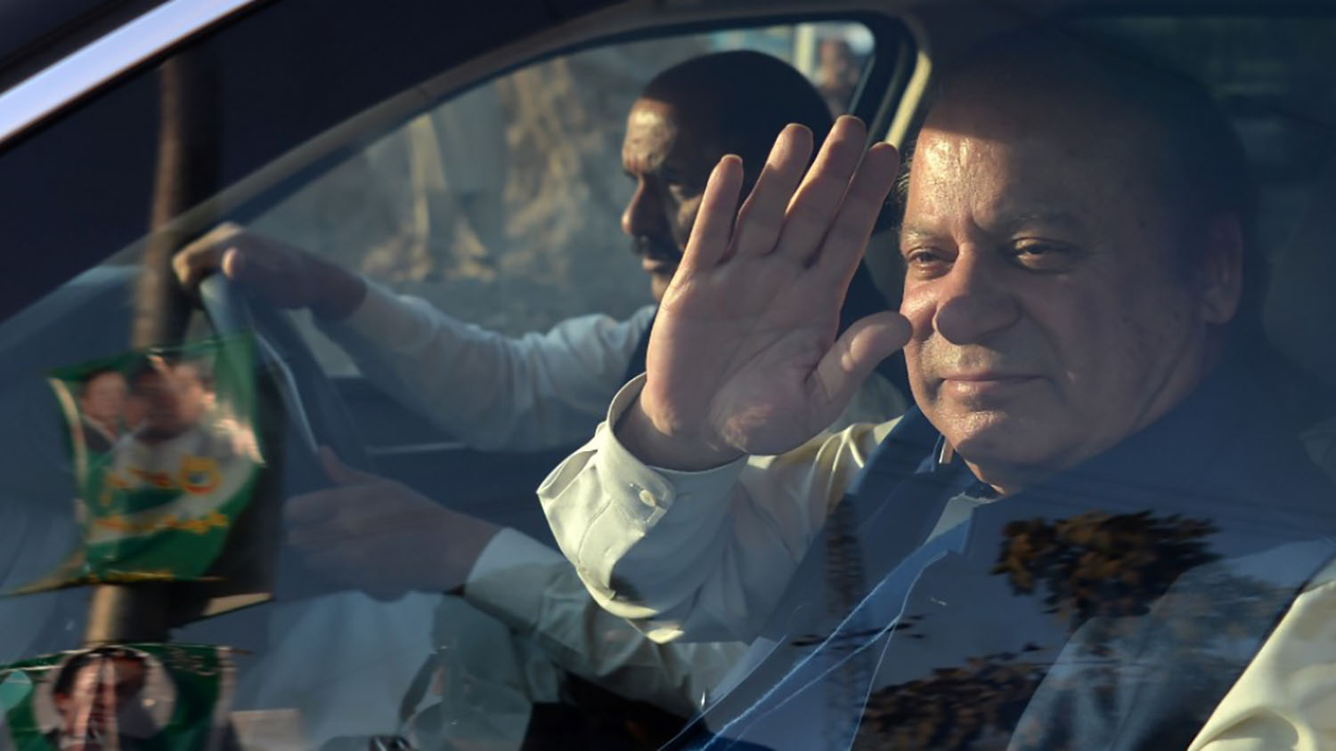 In this file photo, former Pakistani prime minister Nawaz Sharif waR as he leaves an accountability court after a personal appearance to face corruption charges in Islamabad on Dec. 4, 2017. (AFP)