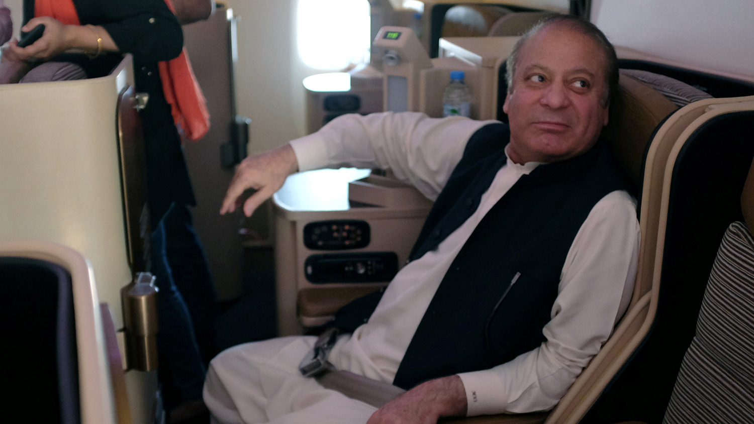 Ousted Pakistani Prime Minister Nawaz Sharif sits on a plane after landing at the Allama Iqbal International Airport in Lahore on July 13, 2018. (REUTERS/File)
