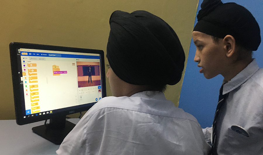 Inside computer classroom two Sikh students are looking at computer screen, 15, November 2019. (AN)