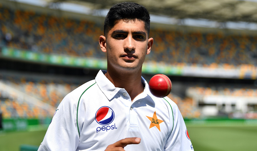 Pakistan's 16-year-old paceman Naseem Shah tosses the ball during a training session at Gabba in Brisbane on November 20, 2019, ahead of the first cricket Test match against Australia. (AFP)