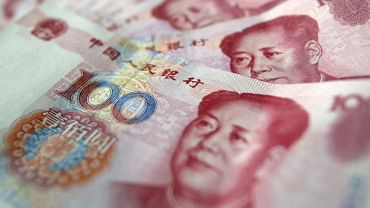 This file photo taken on July 18, 2003, shows 100 yuan, or renminbi (rmb), notes in Beijing. (AFP)