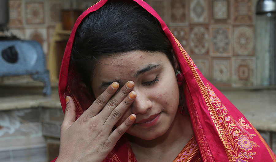 In this file photo, Pakistani Christian Mahek Liaqat, who married a Chinese national, cries as she narrates her ordeal, in Gujranwala, Pakistan on April 14, 2019. (Photo by AP)