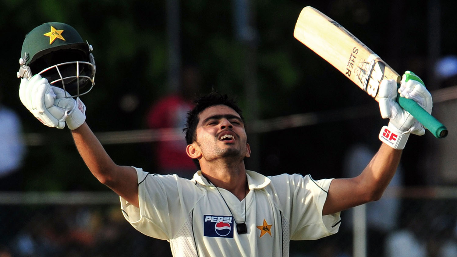 In this file photo, Pakistan cricketer Fawad Alam raises his bat after he scored a century during the second day of the second Test match between Pakistan and Sri Lanka in Colombo on July 13, 2009. (AFP)
