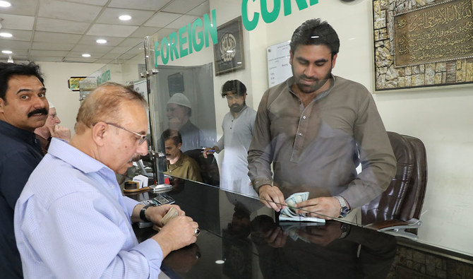 Customer at currency dealers is counting Pakistani rupees in Islamabad on Monday, April 1, 2019. (AN Photo)