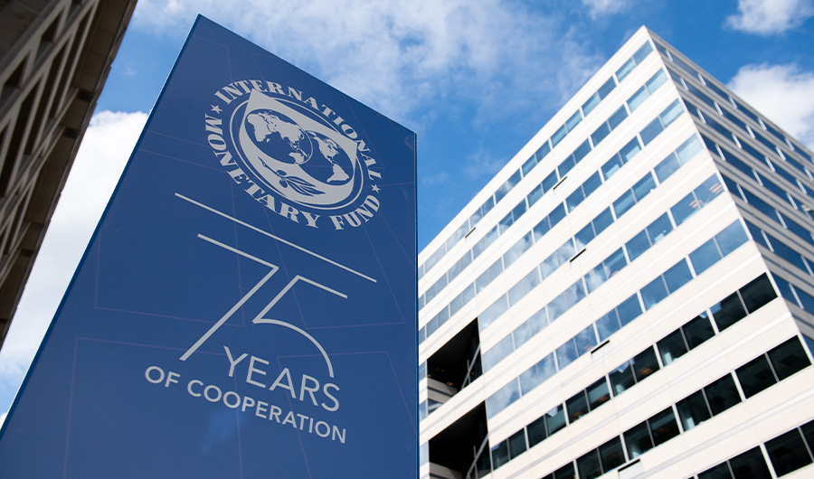 Signs for the upcoming IMF / World Bank Annual Meetings hang outside International Monetary Fund Headquarters in Washington, DC on October 7, 2019. (AFP)