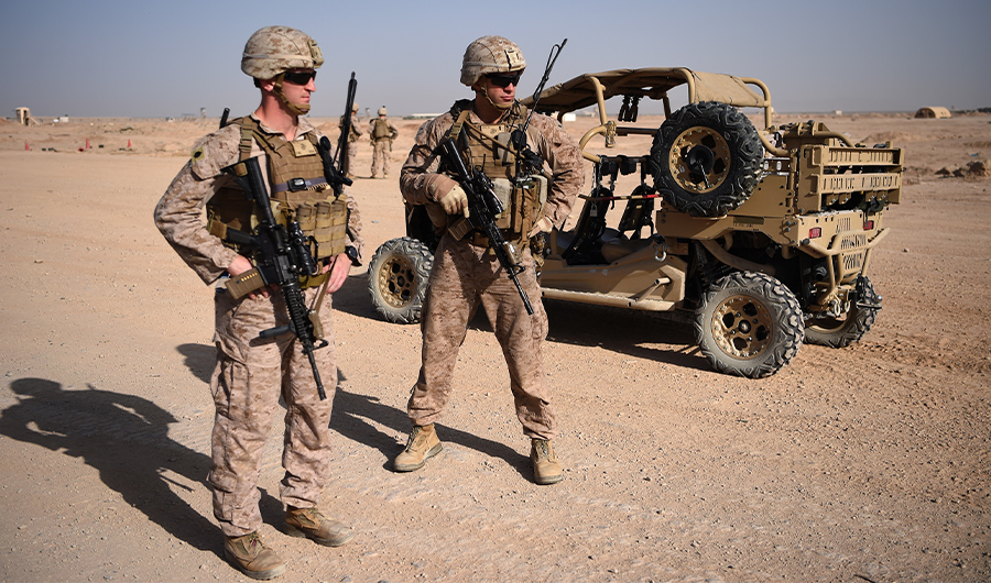 In this photograph taken on August 28, 2017 US Marines keep watch as unseen Afghan National Army soldiers participate in an IED (improvised explosive device) training exercise at the Shorab Military Camp in Lashkar Gah in the Afghan province of Helmand. (AFP)