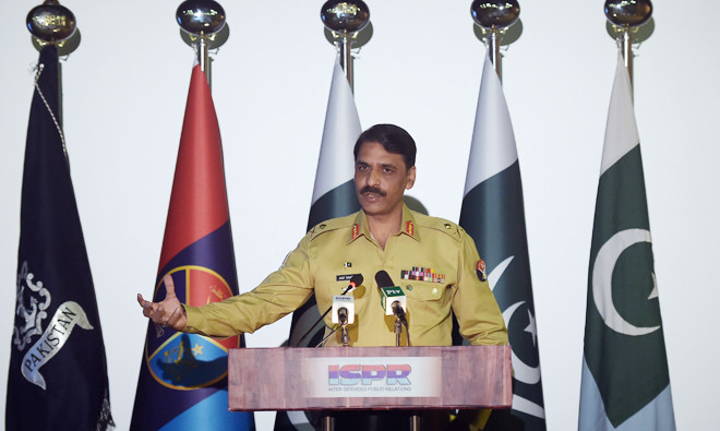 Pakistan's army spokesman Major General Asif Ghafoor speaks with media representatives as he gives details of a captured would-be female suicide bomber Noreen Leghari during a press conference in Rawalpindi on April 17, 2017. (AFP)