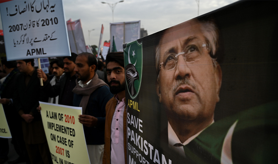 Supporters of the All Pakistan Muslim League (APML), the party of former military ruler Pervez Musharraf, carry placards as they shout slogans during a protest following a special court's verdict, in Islamabad on December 18, 2019. (AFP)